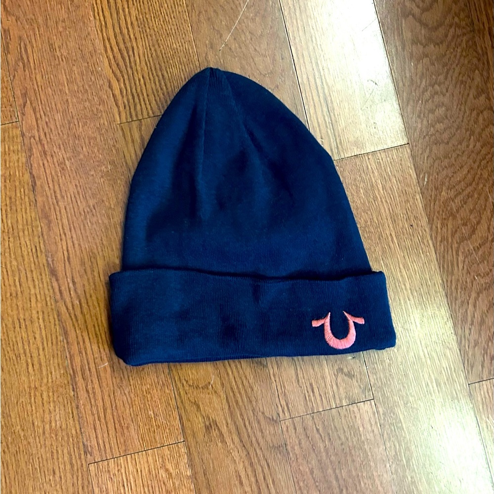 True religion knit hat.  Dark navy with pink emblem NWOT